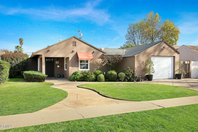 view of front of house with a garage and a front lawn