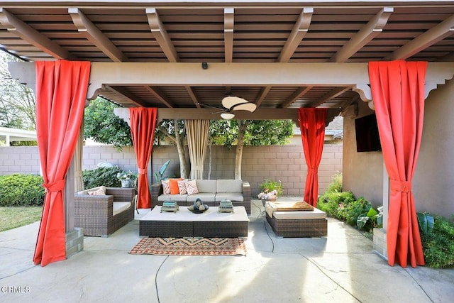 view of patio with an outdoor living space and ceiling fan