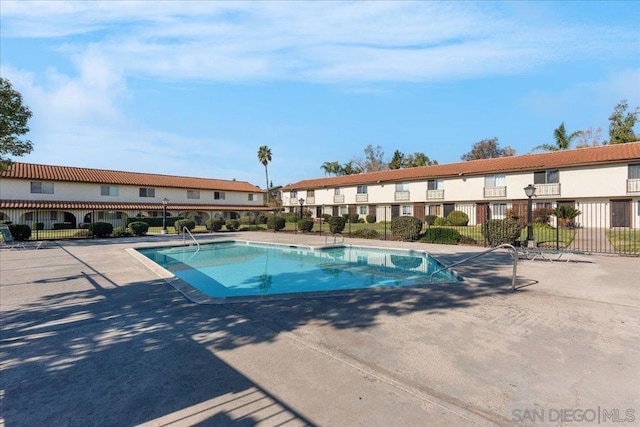 view of swimming pool featuring a patio area