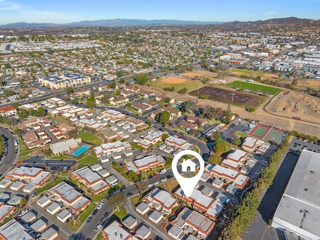 birds eye view of property featuring a mountain view