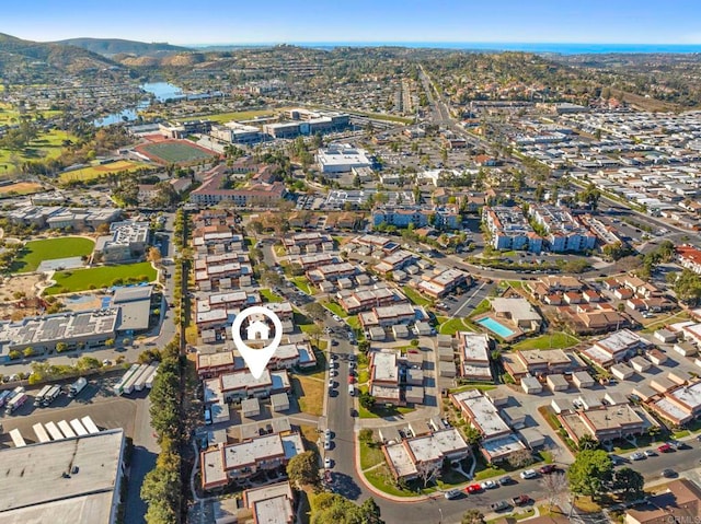 drone / aerial view with a residential view and a mountain view