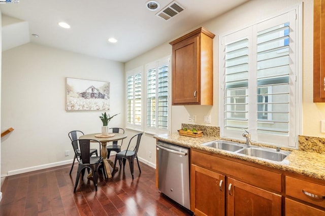 kitchen with sink, dark hardwood / wood-style floors, dishwasher, and light stone counters