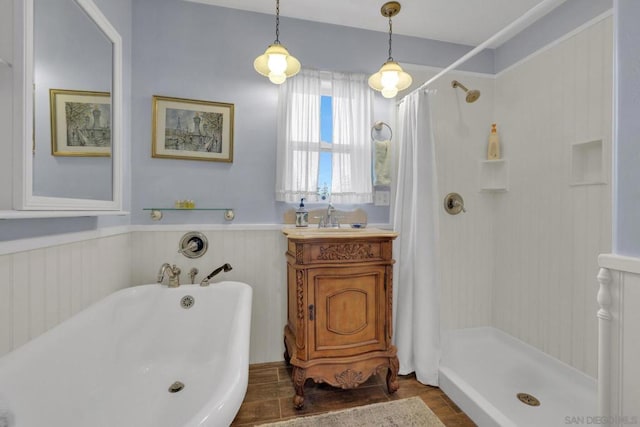 bathroom featuring vanity and independent shower and bath