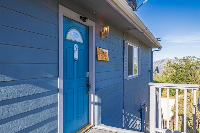 doorway to property with a mountain view