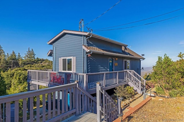 rear view of house with a deck