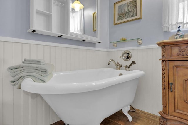 bathroom featuring a washtub and wood-type flooring