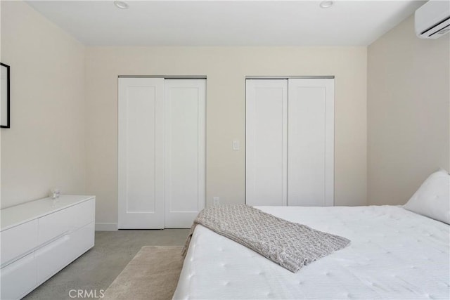 2249 Shoredale Ave, Los Angeles, CA 90031 - bedroom featuring a wall unit AC and two closets