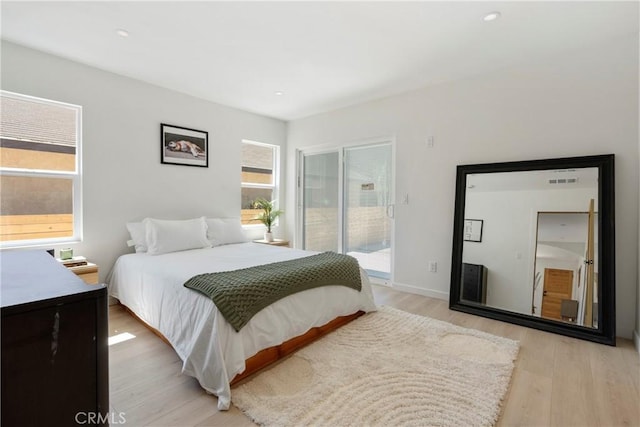2249 Shoredale Ave, Los Angeles, CA 90031 - bedroom featuring access to outside, multiple windows, and light wood-type flooring