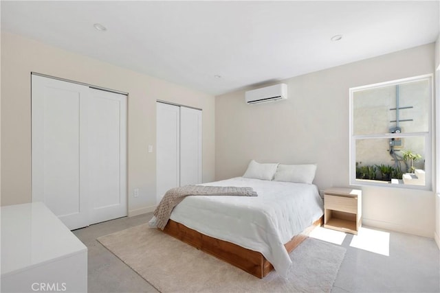 2249 Shoredale Ave, Los Angeles, CA 90031 - bedroom with a wall mounted air conditioner and multiple closets