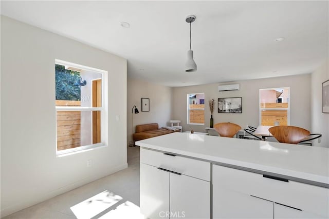 2249 Shoredale Ave, Los Angeles, CA 90031 - kitchen featuring white cabinets, pendant lighting, and an AC wall unit
