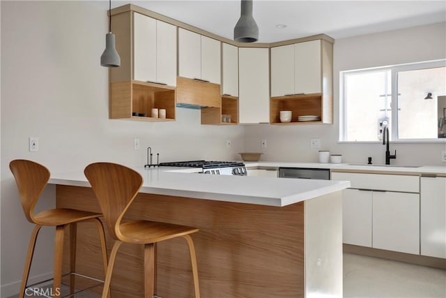 2249 Shoredale Ave, Los Angeles, CA 90031 - kitchen with a breakfast bar, stove, sink, kitchen peninsula, and custom range hood