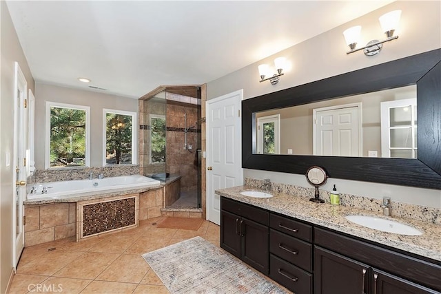 bathroom with vanity, plus walk in shower, and tile patterned flooring