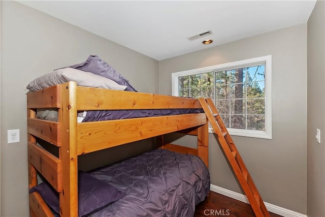 bedroom featuring dark wood-type flooring