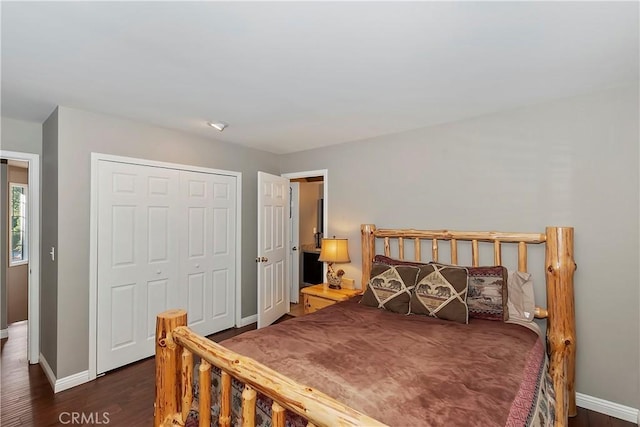 bedroom featuring dark wood-type flooring and a closet