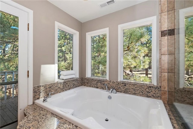 bathroom featuring a tub