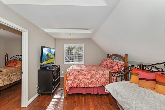 bedroom featuring lofted ceiling and dark hardwood / wood-style floors