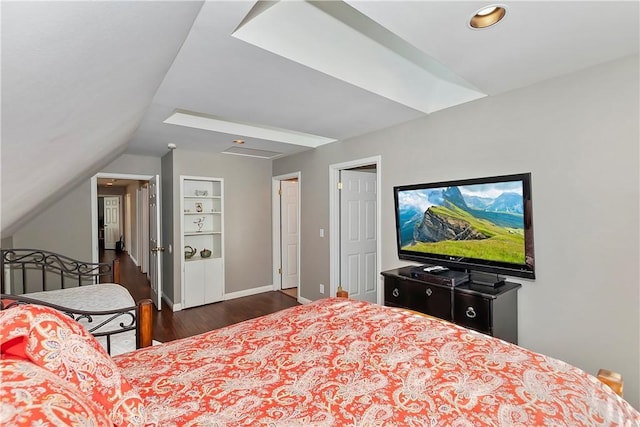 bedroom featuring dark wood-type flooring and vaulted ceiling