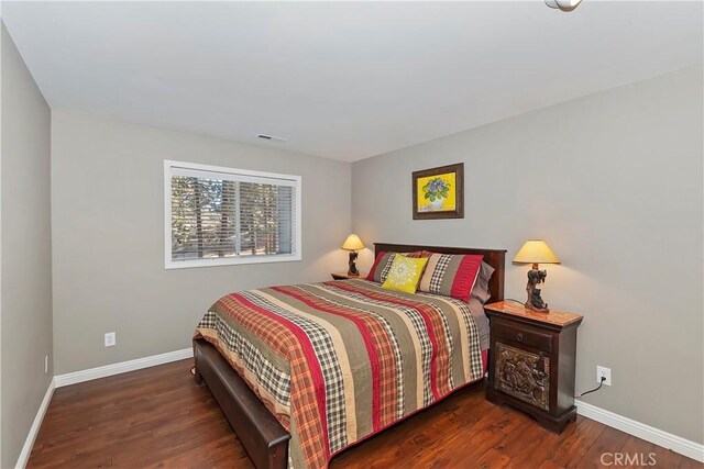 bedroom featuring dark wood-type flooring