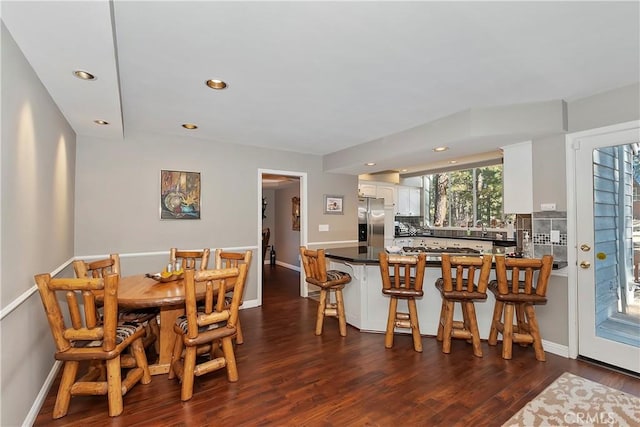 dining room featuring dark hardwood / wood-style floors and sink