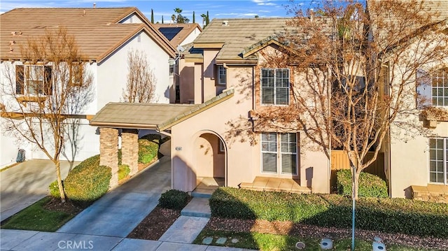 view of front of property with a carport