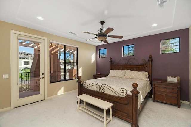 bedroom featuring access to exterior, light carpet, and ceiling fan