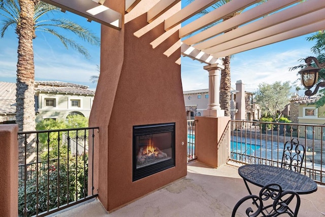 view of patio / terrace with a fenced in pool and a pergola