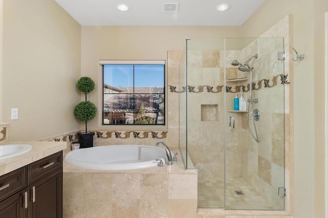 bathroom with vanity and plus walk in shower