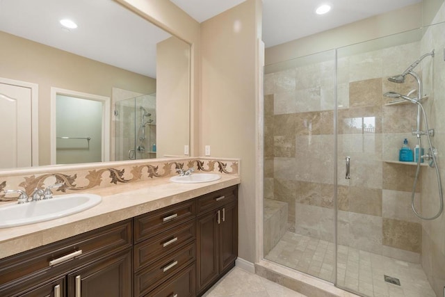 bathroom with tile patterned flooring, vanity, and an enclosed shower