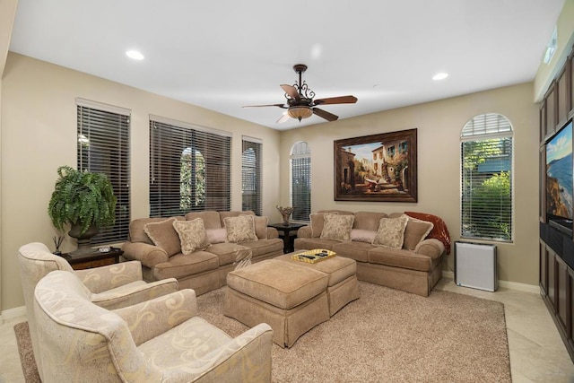 tiled living room featuring ceiling fan