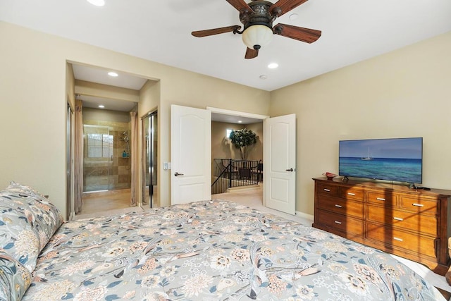 bedroom featuring ensuite bath and ceiling fan