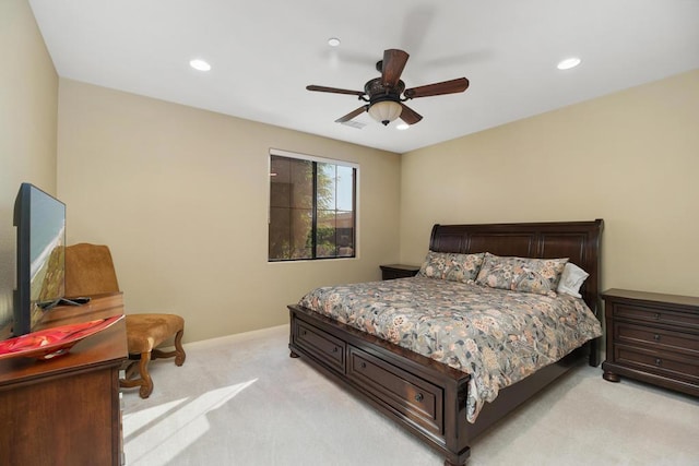 bedroom featuring light carpet and ceiling fan