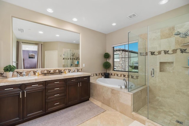 bathroom with tile patterned floors, vanity, and separate shower and tub