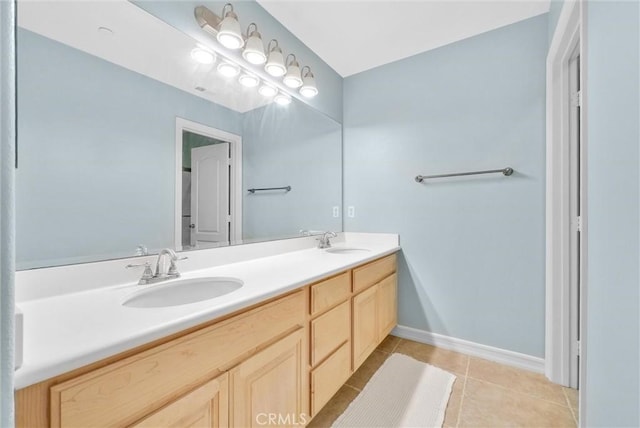 bathroom with tile patterned flooring and vanity