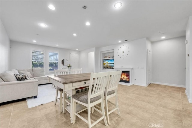 dining space featuring built in shelves