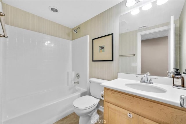 full bathroom with vanity,  shower combination, and toilet