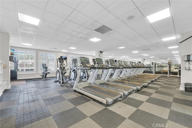 workout area featuring a paneled ceiling