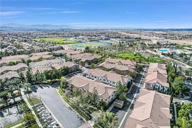 birds eye view of property featuring a mountain view