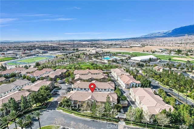 birds eye view of property featuring a mountain view