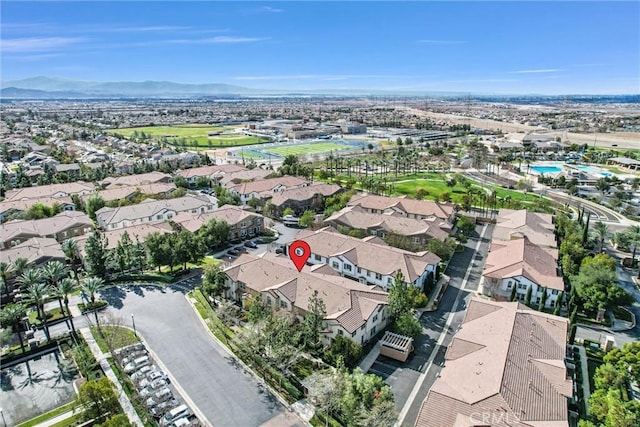 birds eye view of property featuring a mountain view