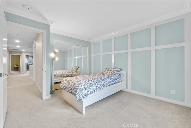 carpeted bedroom with crown molding