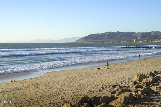 property view of water with a beach view and a mountain view