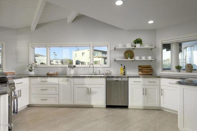 kitchen featuring sink, white cabinets, dishwasher, and lofted ceiling with beams