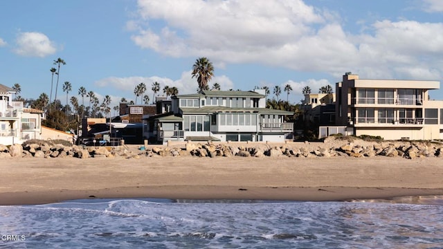 exterior space with a beach view and a water view