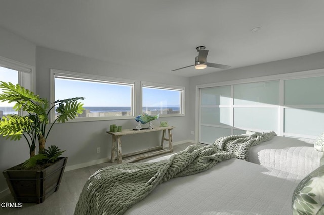 bedroom featuring ceiling fan and carpet flooring