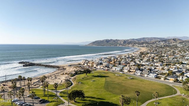 birds eye view of property with a beach view and a water and mountain view