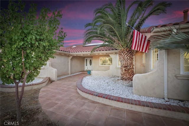 view of patio terrace at dusk