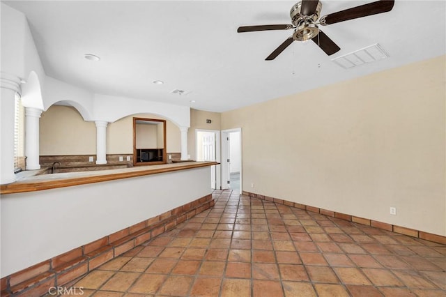 unfurnished living room featuring ceiling fan