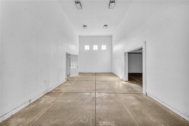 corridor featuring concrete floors