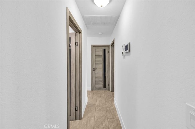 hallway with light tile patterned floors