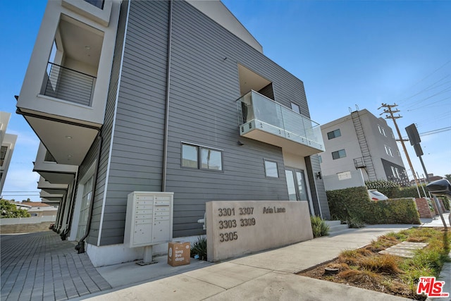 view of side of property with mail boxes